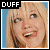 Pixelated image of two side-by-side portraits labeled DUFF and LOHAN with VS text between them, showing blonde women in separate colored backgrounds.