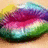 Pixelated lips with rainbow gradient colors on a light brown background, showing subtle animation changes across frames.
