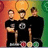 Three figures in black shirts stand against a gradient background of orange, yellow, and green; the central figure wears a shirt with a skull graphic.
