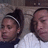 Two people lie on a couch; one wears a white shirt and dark turtleneck, the other has a headband. The scene shifts slightly across frames.