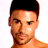 Static pixelated image of a person's upper face and shoulder with short dark hair, light skin tone, visible facial features including eyes, nose, mouth, and stubble, against a plain white background.
