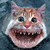 Pixelated close-up of a cat-like creature with wide eyes, pink nose, and exaggerated open mouth showing teeth against dark blue background.