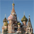 Pixelated image of a building with multiple domes and spires against a clear blue sky.