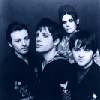 Six monochrome blue-toned images arranged in a showing various people with distinct hairstyles and clothing, some holding microphones