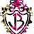 A symmetrical pink and white emblem with a large stylized 'B' at its center, framed by ornate floral and scrollwork details.