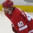 A red bottle with a white label and '10' text appears on a blurred background, with red displaying pixelated text 'Hank It Up A Little' and 'Zetter Is Better'