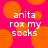 Pixelated text on a bright pink background with orange circles, displaying 'anita rox my socks' in white block letters.