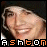 Pixelated close-up of a smiling person with light skin and dark hair, below which appears stylized text reading "ASHTON ASHTON" in orange and white block letters.