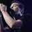 A 48x48 pixel buddy icon featuring a split design with a musician performing on stage and a band logo, displayed as part of an animated contact sheet.