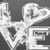 A grayscale pixelated image of stylized text with overlapping characters and a dark background.