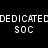 Black background with white pixelated text 'DEDICATED SOC' above a person in dark vest and light shirt seated at table.