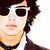 Pixelated portrait of a person with dark curly hair, white sunglasses, red lips, and a black choker necklace against a white background.