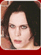 A static image of a person with dark hair and pale skin in five distinct facial expressions against a brick wall background.