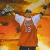 A pixelated figure in an orange jersey with number 13, white undershirt, and dark pants stands against a warm-toned gradient background.