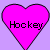 Two identical pink hearts with black outlines on a light purple background, each containing the word 'Hockey' in pixelated text.