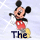 Pixelated Mickey Mouse icon with red shorts, yellow shoes, and black gloves holding a white flag against light blue background.