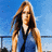 A pixelated image of a woman with long brown hair in a blue sleeveless top against a bright blue sky background, overlaid with fragmented text phrases.
