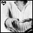 A person in a white V-neck shirt forms a heart shape with hands, while the top-left corner displays a pixelated black heart symbol.