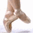 Four distinct shoe styles arranged in a : beige ballet shoes, black dress shoes, pink ballet shoes, and black tap shoes with white soles