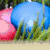 Pixelated Easter-themed image with eggs, grass, and bunnies, featuring text overlays on blue and pink backgrounds.
