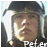 A pixelated image of a person wearing a helmet with white ear flaps, partially obscured by text reading "Peter" at the bottom.