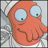 A cartoon character with orange skin, large light blue eyes, and a white chef's hat, smiling with a hand near its face.