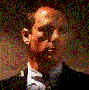 A man in a black suit and white shirt appears across showing sequential head movements from left to right