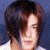 Four pixelated show a person with dark hair in different poses: front-facing, profile left, wearing yellow headgear, and side view