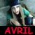 A pixelated image of a person with long blonde hair wearing a blue headband and teal clothing, next to red text reading AVRI LAVIGNE on black background.