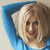 Static pixelated image of a person with light brown hair and red lips against blue background, likely a celebrity icon from early 2000s AOL Instant Messenger collection.