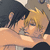 Two figures embrace in a close-up; one has dark hair, the other blonde hair with visible strands and highlights.
