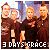 Four pixelated figures in brown clothing stand together against a blurred background with text reading '3 DAYS GRACE' at the bottom.