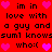Red background with black text and pink hearts; text repeats 'im in love with a guy and a guy and suml knowsssuml knows who:(', hearts animate in place.