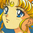 Pixelated close-up of a character's face with blonde hair, blue eyes, and yellow crescent earrings against a blue background.