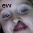 A close-up of a person's face with blue eyes and a wide open mouth showing teeth, with the text 'ew' in the top-left corner.