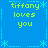 Blue background with repeated pixelated text "tiffany loves you" in yellow-green, framed by light blue dashed lines and asterisk-like symbols.