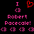 Pixelated pink and red text on black background with heart symbol above name.