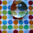 Pixelated icon of a character with brown hair and dark eyes, set against a grid of colored squares in blue, green, yellow, orange, and red.