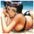 Pixelated image of a person with dark hair wearing a blue headband, lying on a beach with one hand near their face and the other resting on the sand.