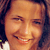 Pixelated close-up of a smiling person with dark hair and warm skin tones in a static 50x50 icon format.