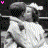 Pixelated animated contact sheet showing two identical astronaut figures in white suits with black helmets, each holding a microphone-like object against a dark background with pink text "Love" at bottom right and a small pink symbol at top left.