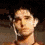 A four- shows a person with short dark hair and earphones in sequential poses against a blurred background