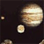 A static pixelated image shows a large planet with horizontal bands and three smaller celestial bodies against a dark background.
