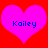 Two identical pink hearts on a red background with blue text reading 'Kailey' inside each heart.