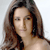 Static pixelated image of a person with long brown hair against a light background, rendered in low resolution typical of early 2000s buddy icons.
