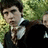 A pixelated image of a person in formal attire with a red background and yellow text reading "neville's had it with these mother f*cking snakes in this mother f*cking school".