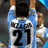 Static 48x48 pixel buddy icon showing a soccer player's back with jersey number 21, light blue and white colors, and brown hair visible at the top of the frame.