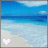 Pixelated beach scene with blue sky, ocean, and sand; two heart icons in bottom corners differ by color.