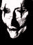 Animated sequence showing a face with black cross symbols over eyes transitioning from pale to brown tones against dark background.