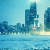Pixelated cityscape with blue-toned skyscrapers, water in foreground, and light sky background.